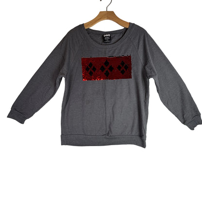 Yardstick beside sweatshirt hem showing body length measurement.