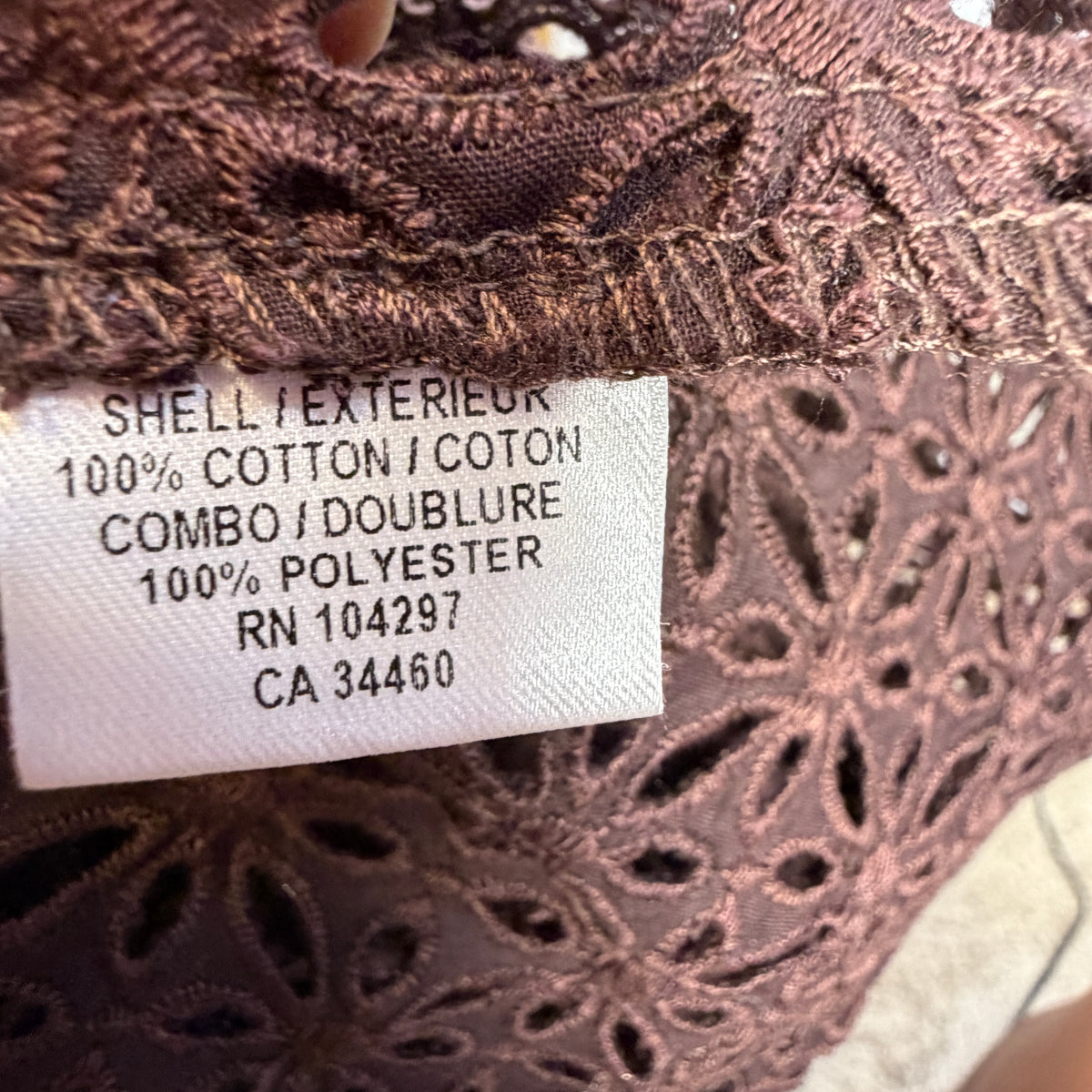 Milly blouse fabric label showing cotton shell and polyester combo