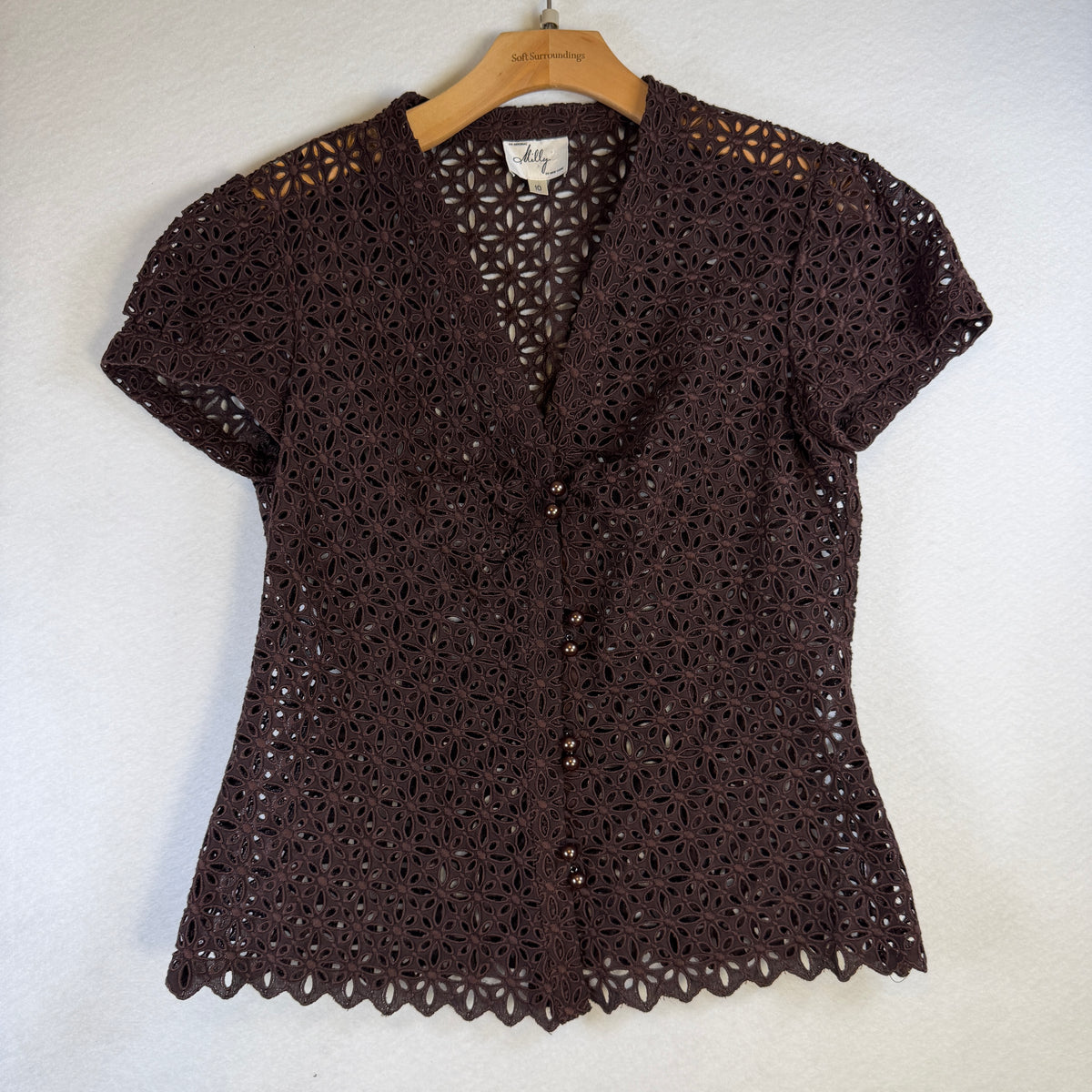 Front view of preloved Milly of New York brown floral eyelet blouse with short sleeves, button front and scalloped hem