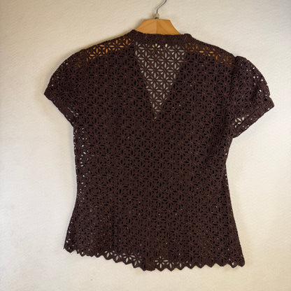 Back of brown Milly eyelet blouse with scalloped hem