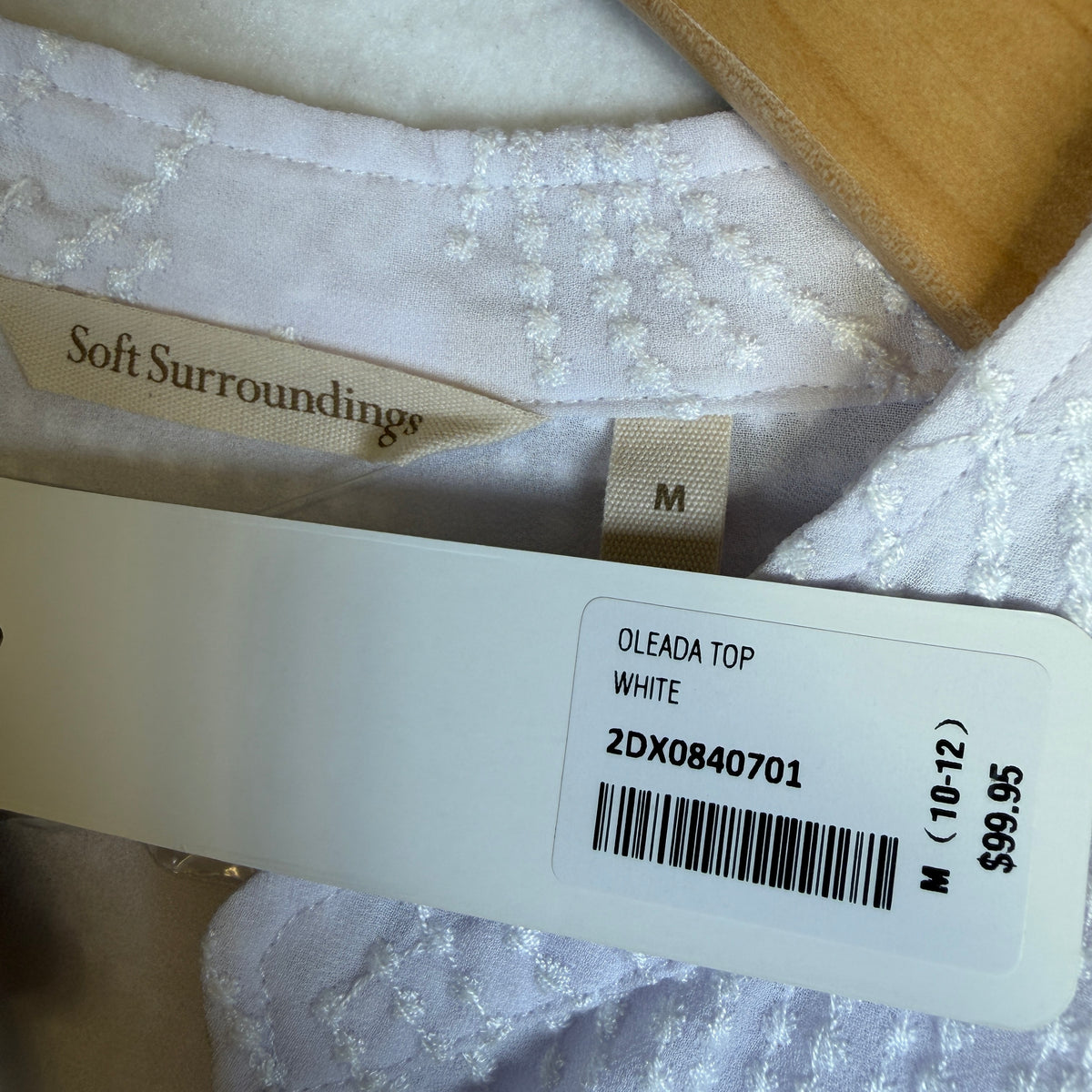 Oleada blouse fiber content and care label