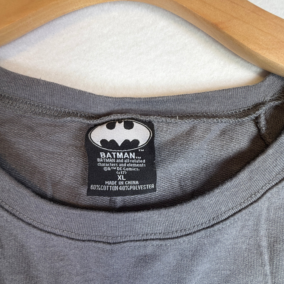 Back of gray long-sleeve raglan sweatshirt with ribbed hem.