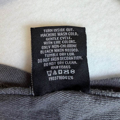Batman DC Comics label showing XL size and 60% cotton 40% polyester composition.