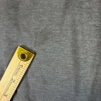 Yardstick across sweatshirt near underarm for sizing reference.