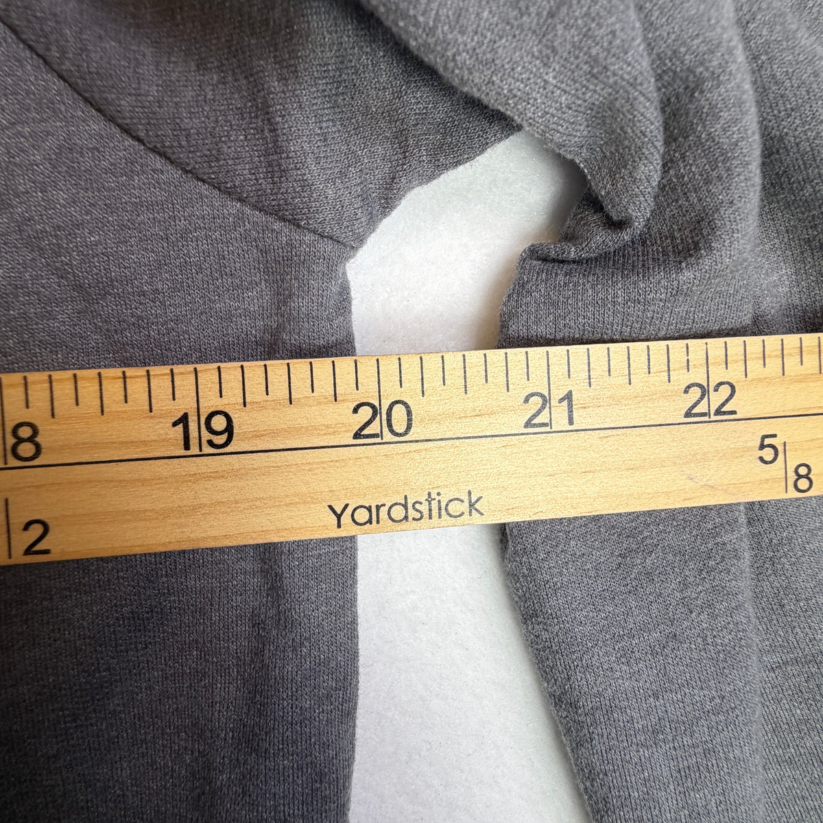 Reversible sequin panel showing Harley lettering on gray sweatshirt.