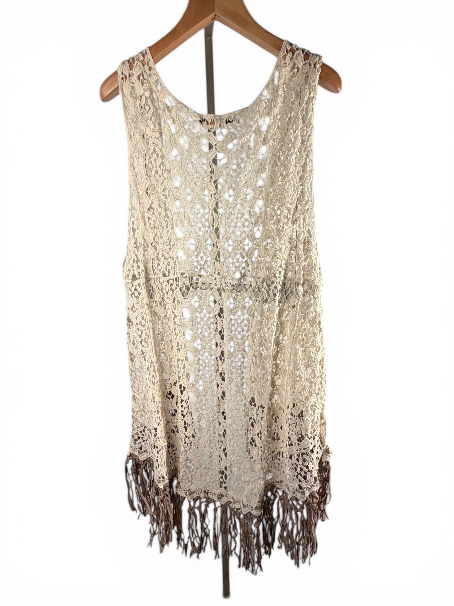 Leah Litty Lew The Boutique ivory crochet lace vest with fringe trim and open front design on a wooden hanger